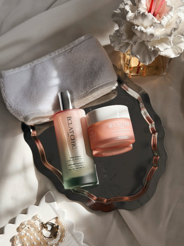 Ultimate Aura Elixir ve Glow Cream, inciler ve keten havlu arasında
